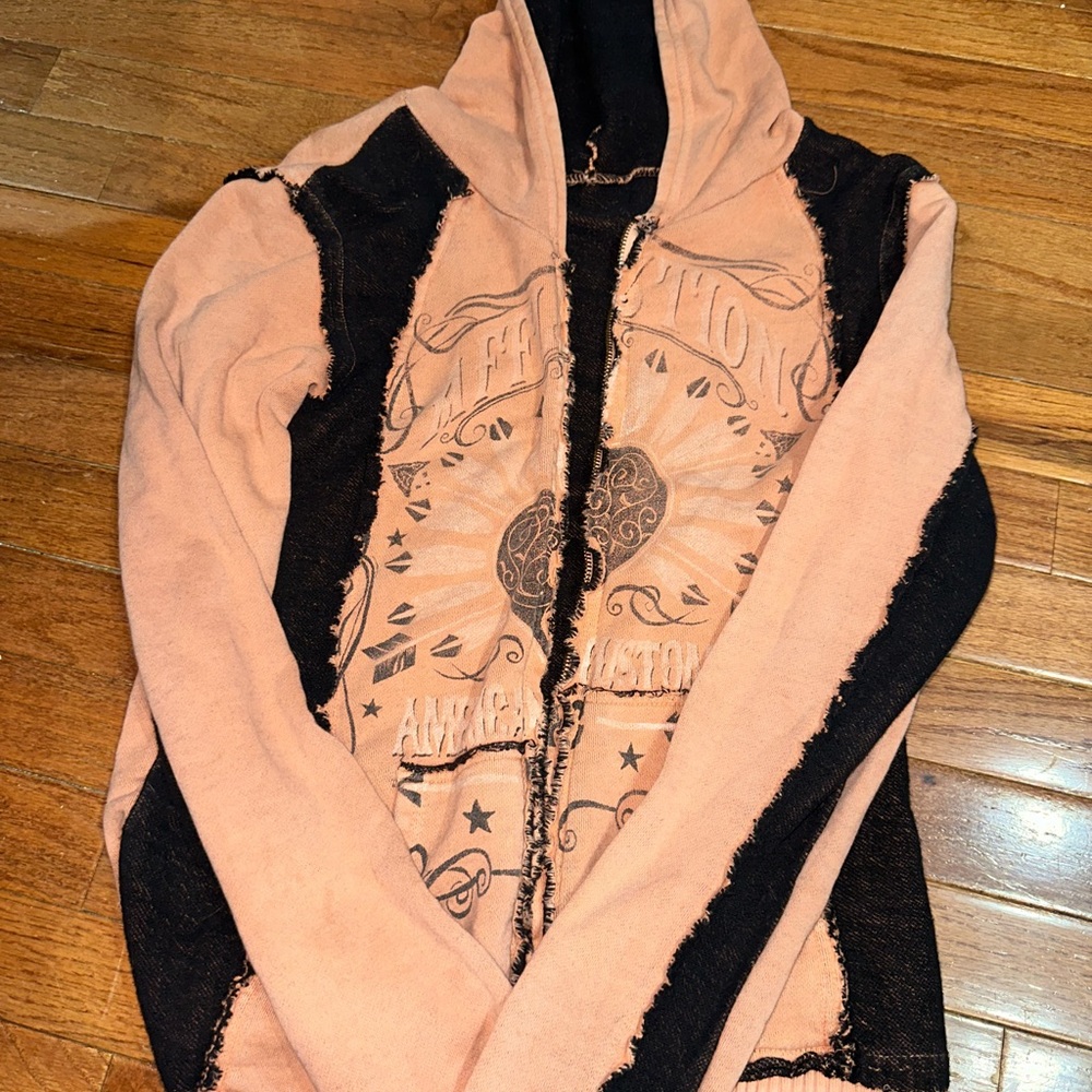 zip up jacket from buckle. Very cute like a peach and black color.